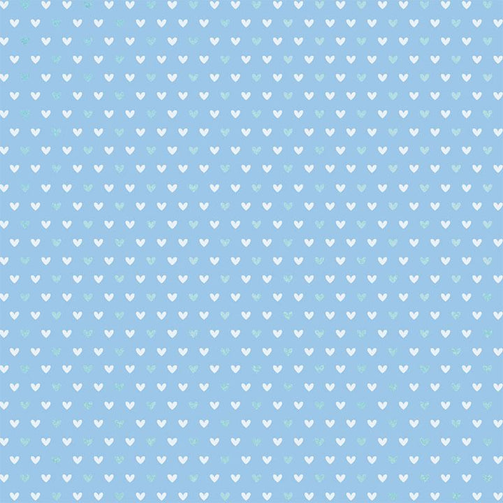 12x12 scrapbook paper featuring a teal and white heart pattern on a blue background.