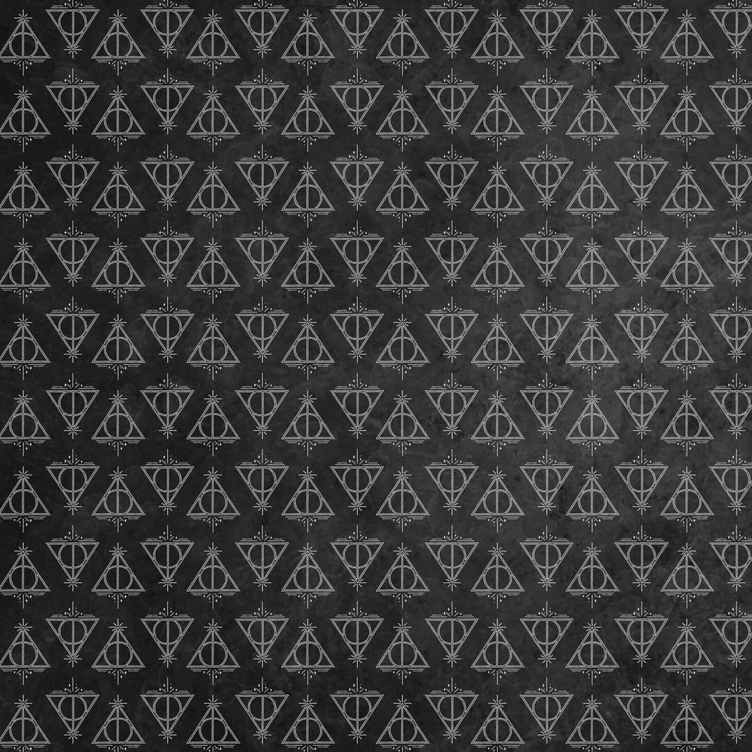 harry potter scrapbook paper featuring a pattern of The Deathly Hallows symbol in white on a black background.