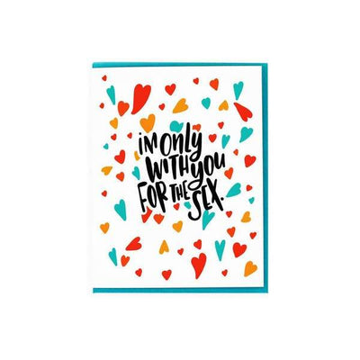 note card featuring multi colored hearts with black text on white, shown with teal envelope on white background.