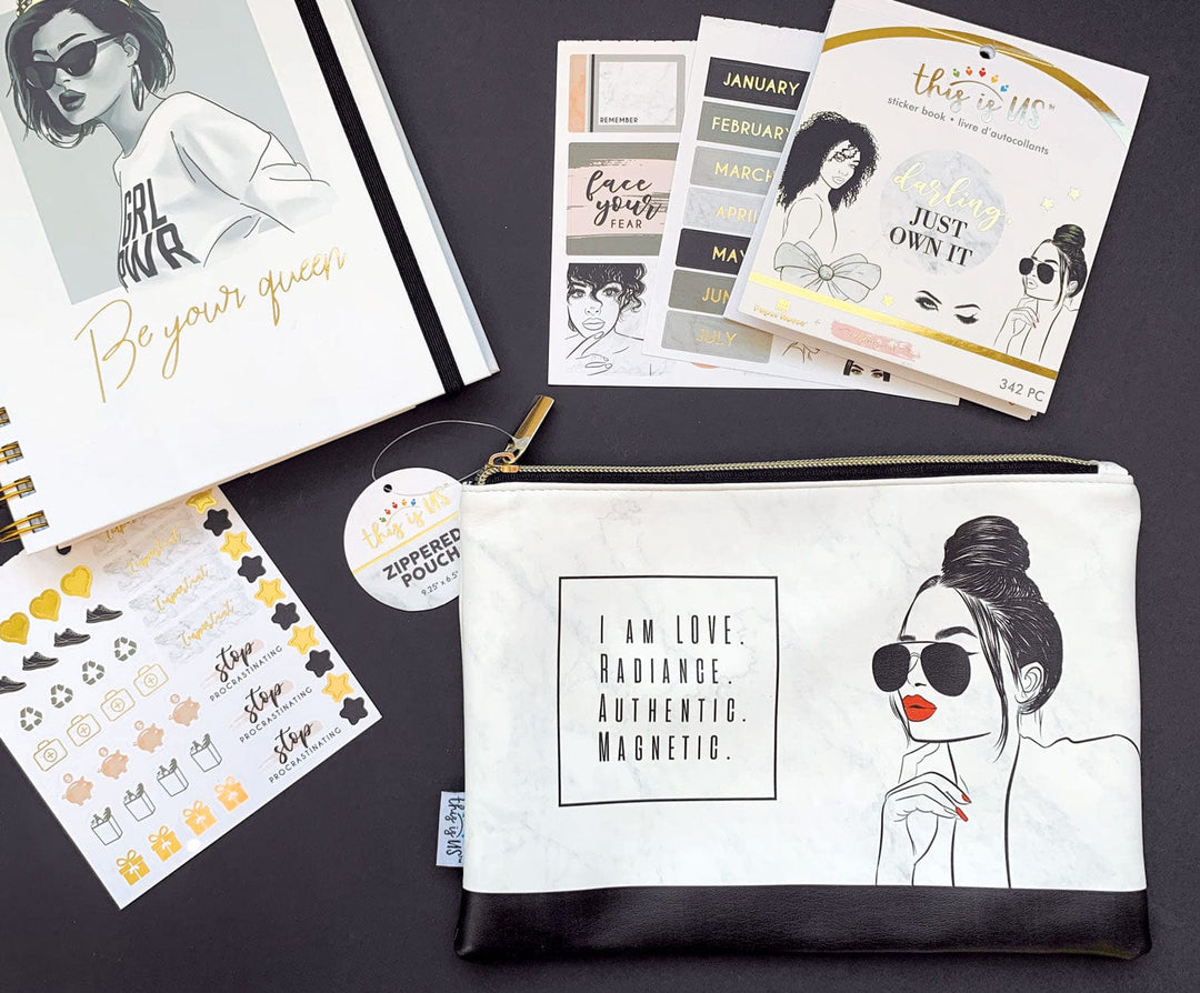 Black and white pencil pouch with gold zipper featuring an illustration of a woman with red lips and words of inspiration shown on black background with related stickers and a journal