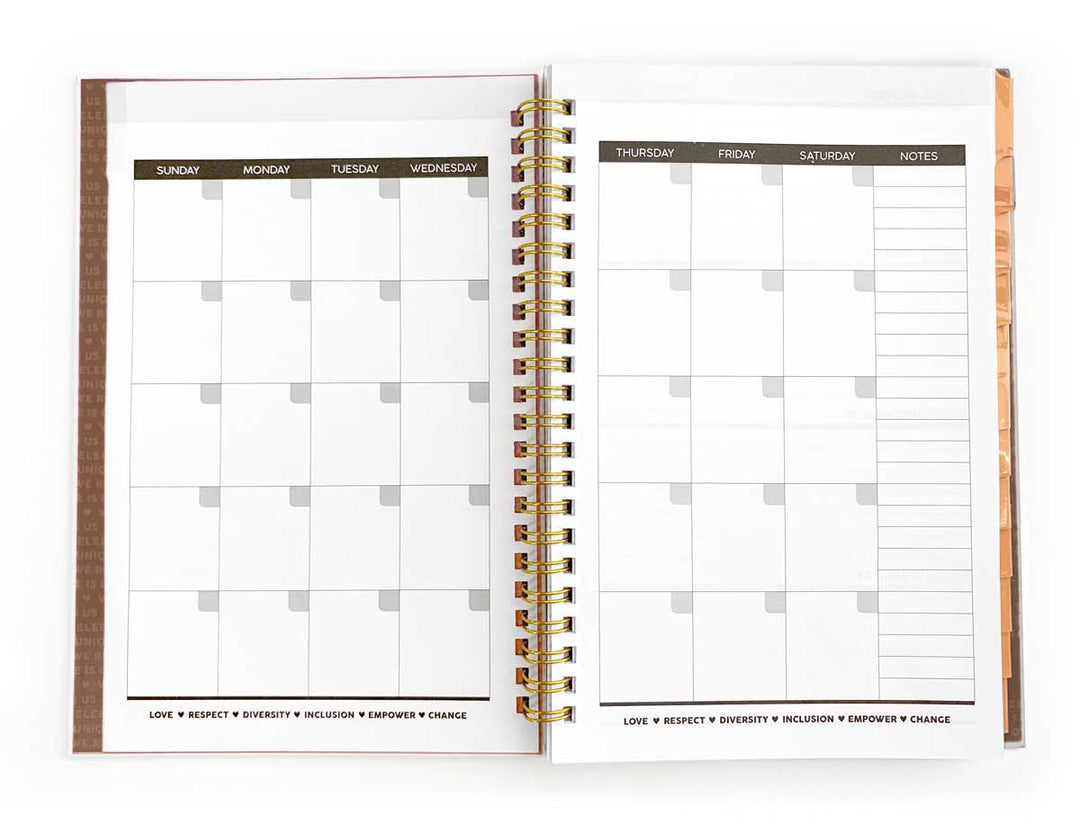 monthly spread of a weekly planner shown open with gold spine, shown on white background.