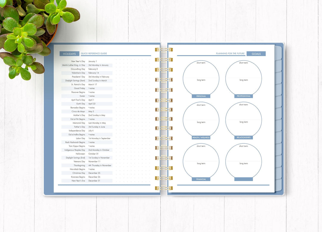 Wild and Free planner organizer image shown open to an inside spread featuring holidays and goals.