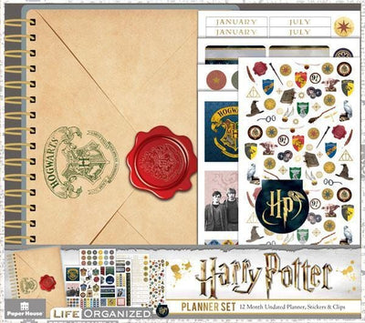 Harry Potter weekly planner set shows package featuring envelope and red seal on cover and multiple sticker sheets.
