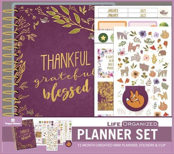 Thankful, grateful, blessed mini weekly planner set shows package featuring purple cover and multiple sticker sheets.