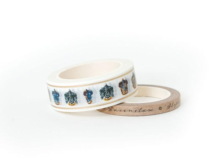 2 rolls of Harry Potter ™ washi tape featuring house crests and house names in script, shown on white background.
