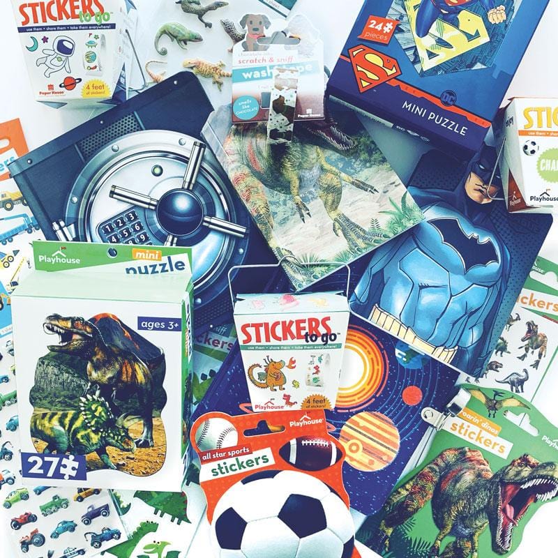 SET-0113E - Rough n Tumble Kids Mystery Box - Colorful assortment of stickers, puzzles, and toys including dinosaurs, sports, superheroes, and space themes scattered on white background