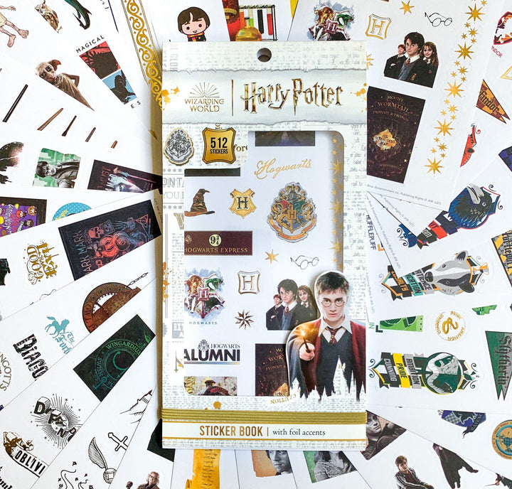 STBK-0008E - Harry Potter Sticker Book - Harry Potter sticker book with 512 foil stickers surrounded by loose Harry Potter-themed stickers and merchandise on white background