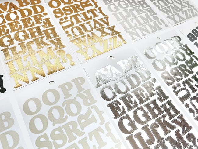 STBK-1000E - Alphabet Stickers - Alphabooks Classic Serifs - Sheets of metallic alphabet stickers in gold, silver, and bronze displaying various serif letters and characters