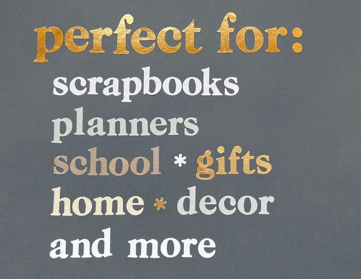 STBK-1002E - Alphabet Stickers - Alphabooks Classic Block - Gold and white alphabet stickers on gray background with text listing uses: scrapbooks, planners, school gifts, home decor