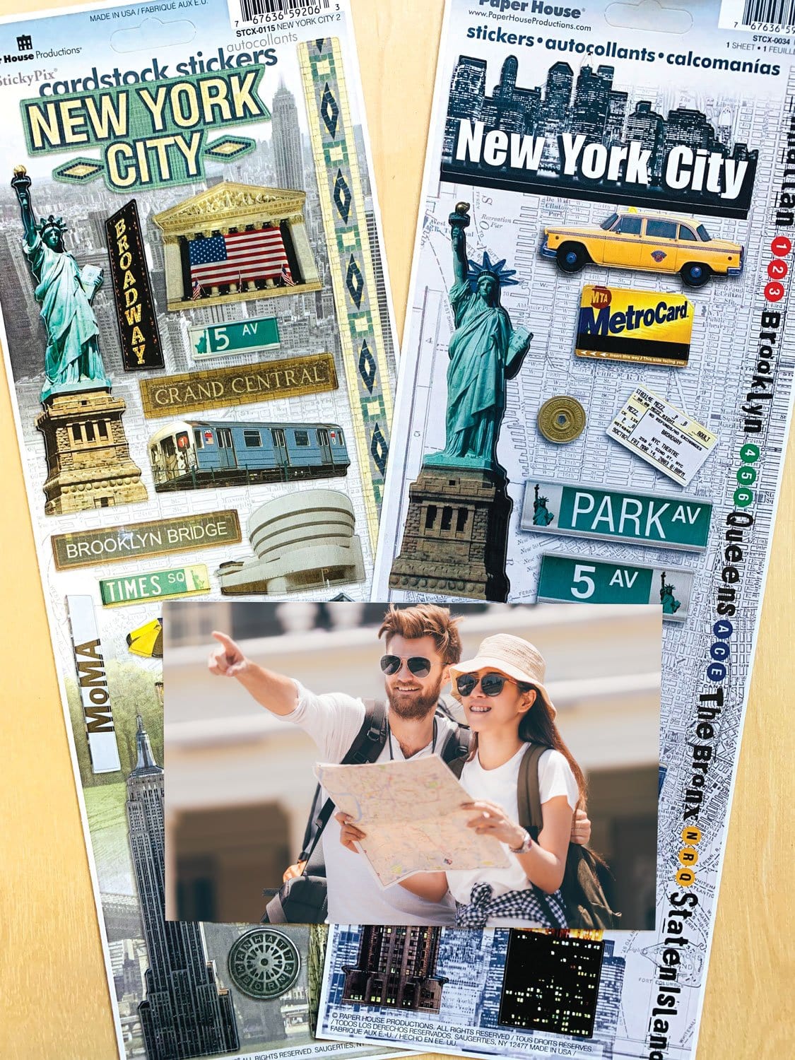 STCX-4000E - Scrapbook Stickers - New York City Value Pack II - Two cardstock sticker sheets featuring NYC landmarks, street signs, yellow taxi, and subway MetroCard designs in gold and teal colors