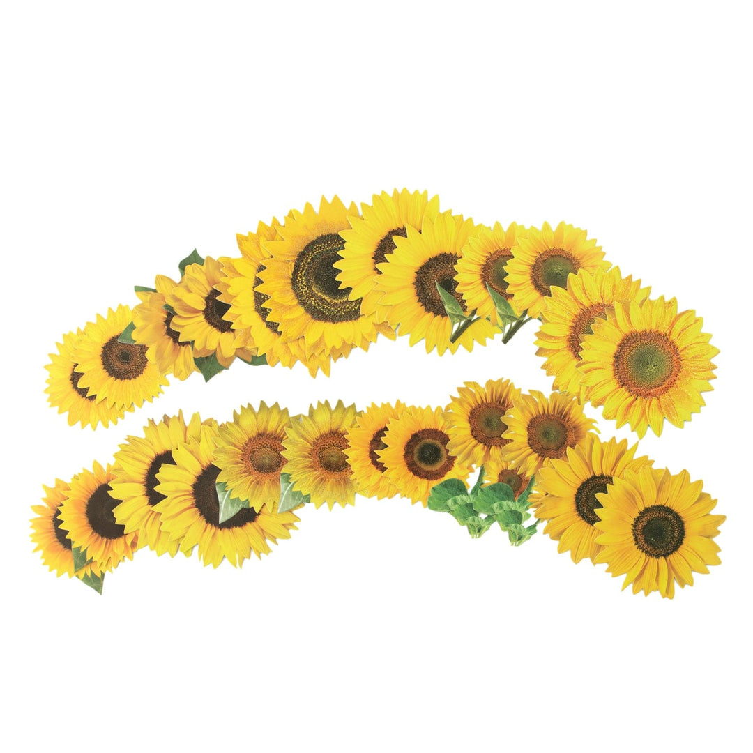 An assortment of scrapbook stickers featuring yellow sunflowers fanned out on a white background.