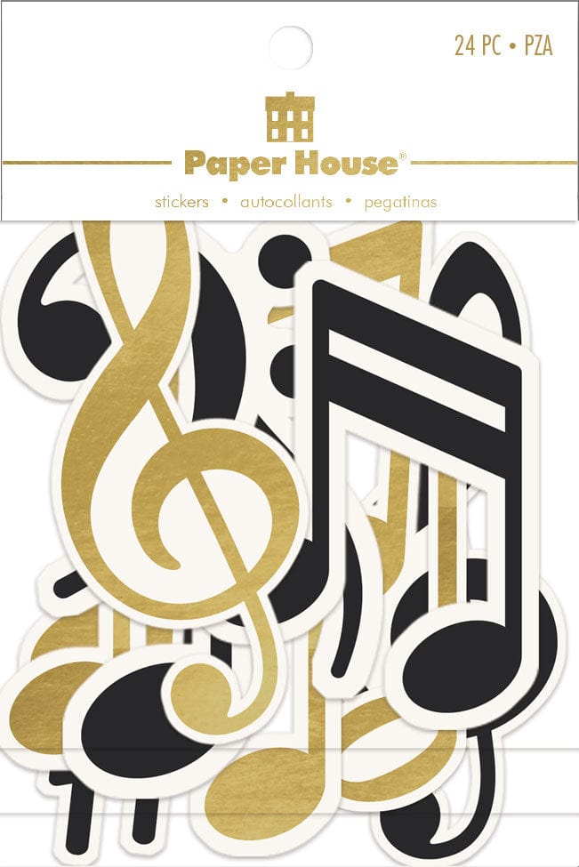 An assortment of scrapbook stickers featuring black and gold music notes shown in packaging.